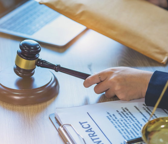 Close-up of judge banging her gavel